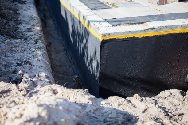 Professional Waterproofing technician working in Lakeland, MI